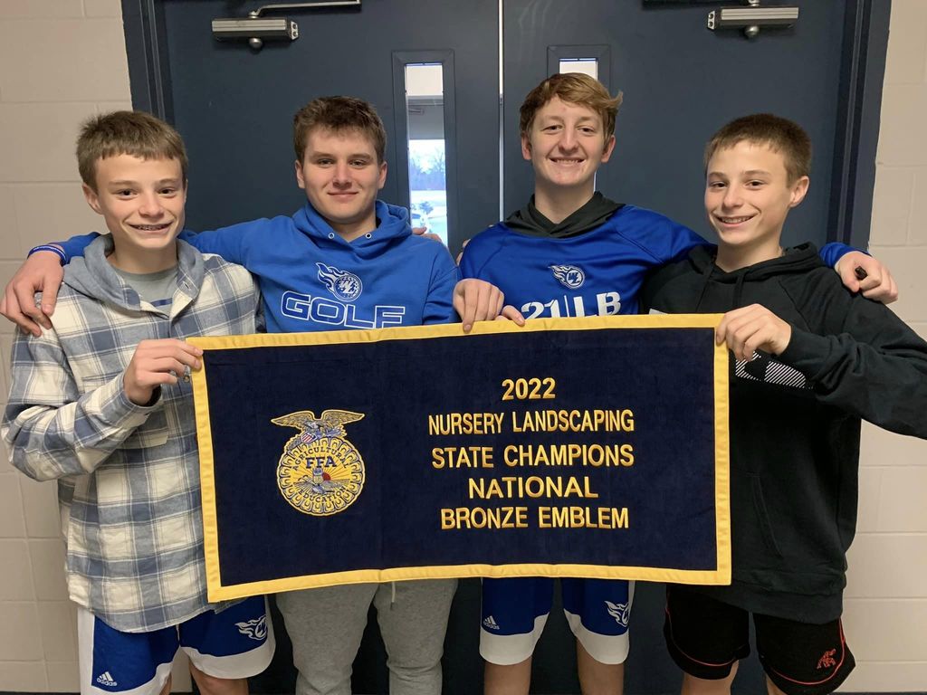 2022 Nursery Landscaping team with their State Champions National Bronze Emblem Banner