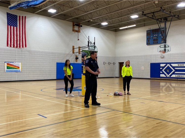 officer Holmes speaks to students